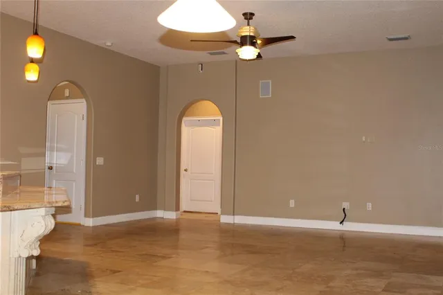 a view of an empty room and window