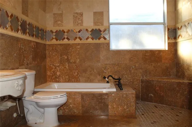 a bathroom with a glass shower door