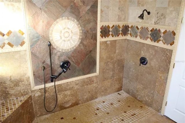 a bathroom with a shower and a shower