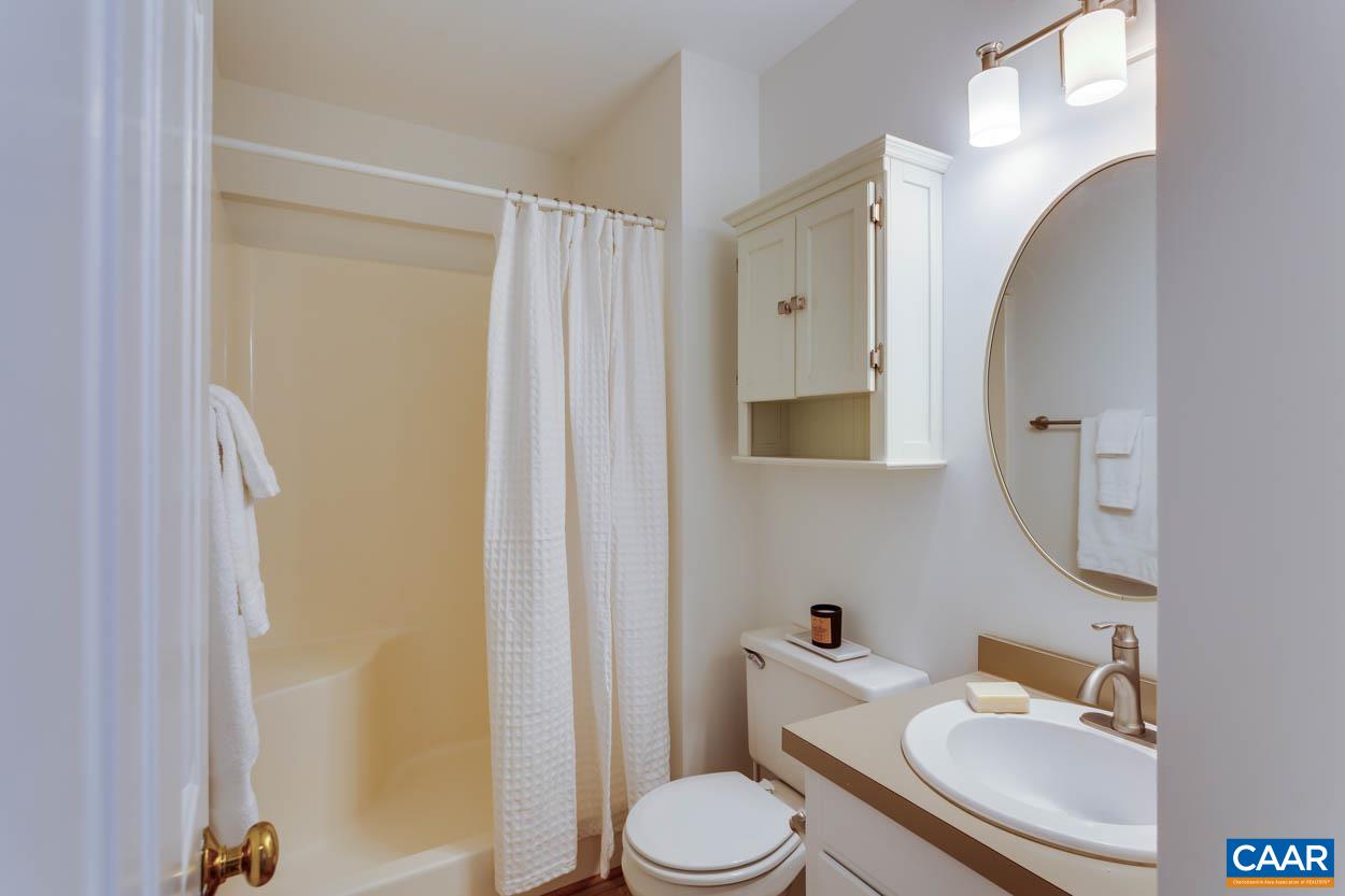 1243 Chatham Ridge Charlottesville, VA 22901 - Photo 13 of 23 a bathroom with a granite countertop toilet sink and mirror