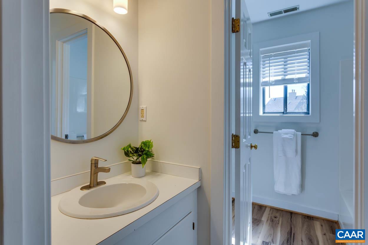 1243 Chatham Ridge Charlottesville, VA 22901 - Photo 18 of 23 a bathroom with a sink and a mirror