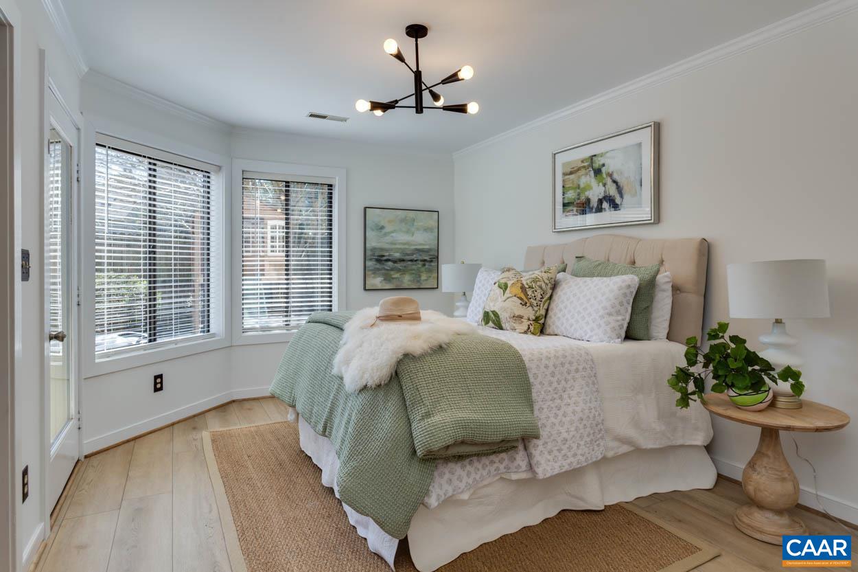 1243 Chatham Ridge Charlottesville, VA 22901 - Photo 10 of 23 a bed sitting in a bedroom next to a window