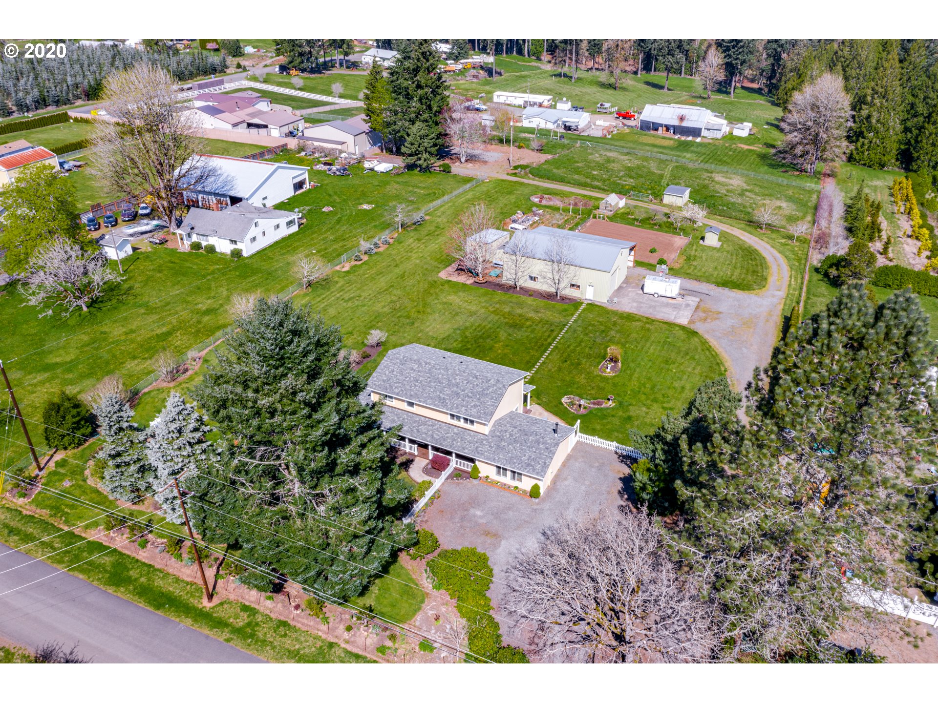 an aerial view of a house with a garden