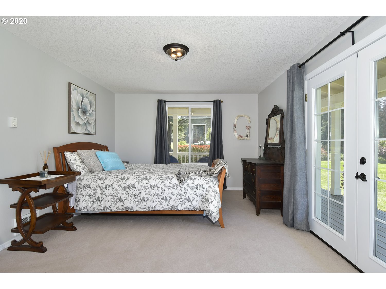 35421 Southeast Gunderson Road Sandy, OR 97055 - Photo 14 of 32 a bedroom with a bed and a view of living room