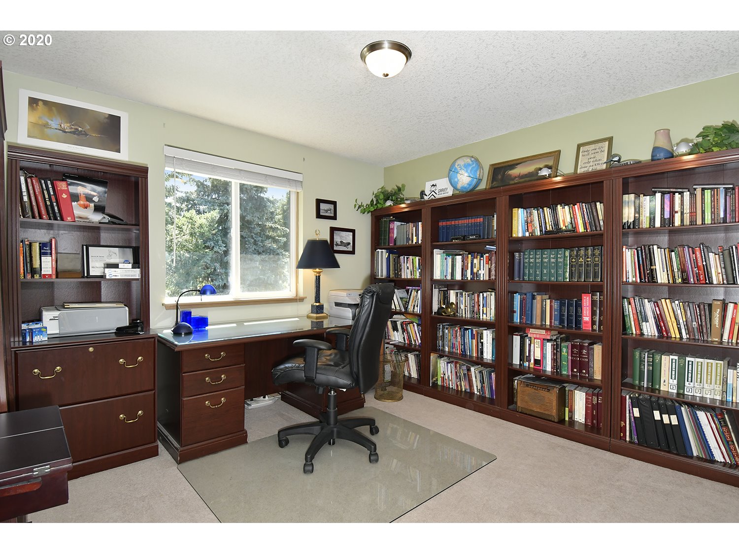 35421 Southeast Gunderson Road Sandy, OR 97055 - Photo 17 of 32 a view of a workspace with bookshelf and a window