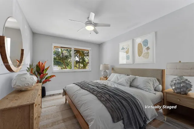 a bedroom with a large bed and a window