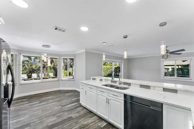 a bathroom with a sink double vanity and a large mirror