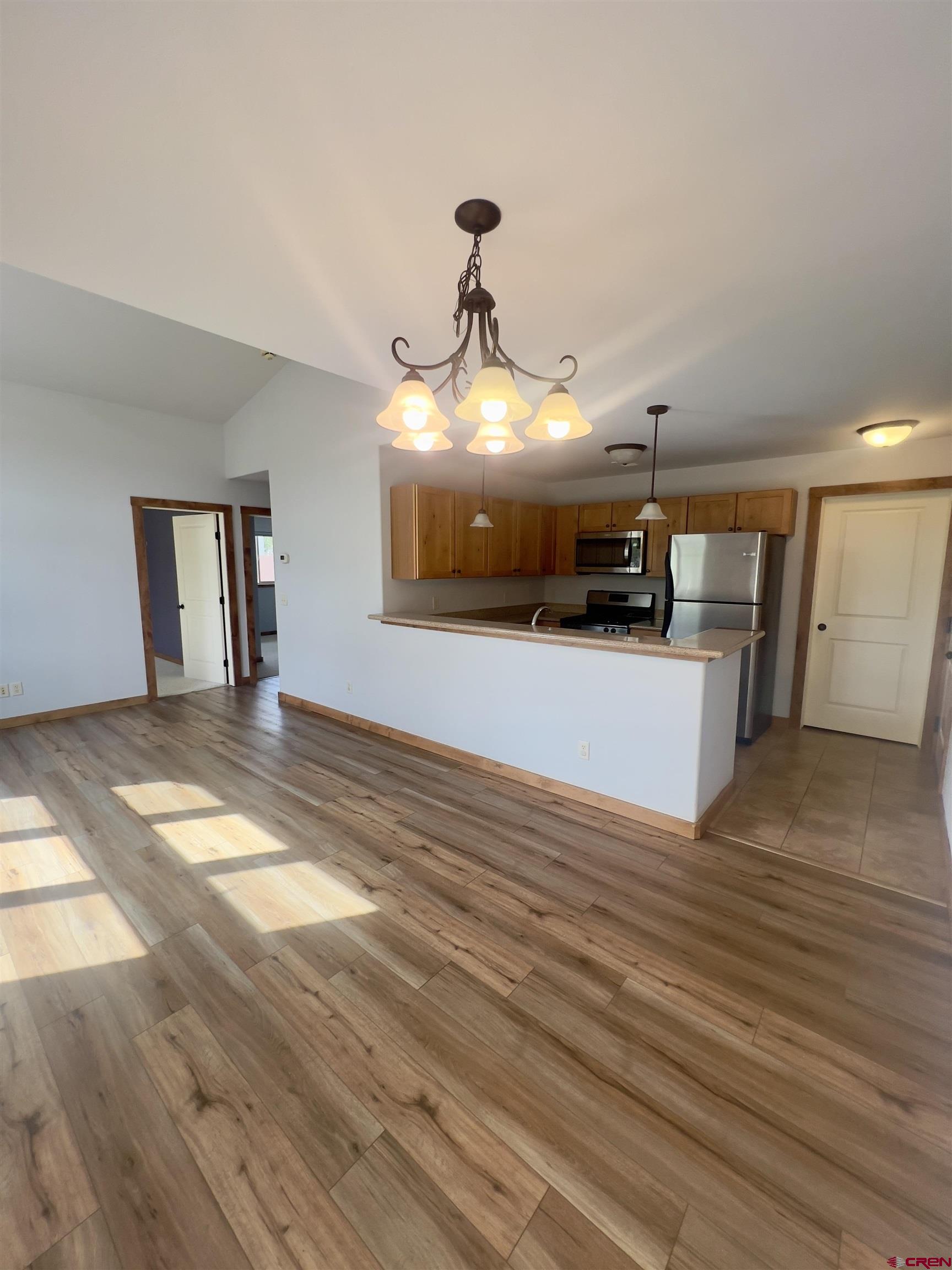 540 Redcliff Circle, Unit E 203 Ridgway, CO 81432 - Photo 15 of 36 a view of a livingroom with wooden floor