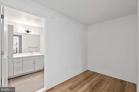 a view of a bathroom with sink and mirror