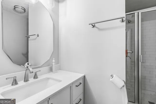 a bathroom with a sink and mirror