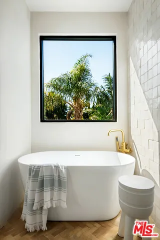 a white bath tub sitting in a bathroom
