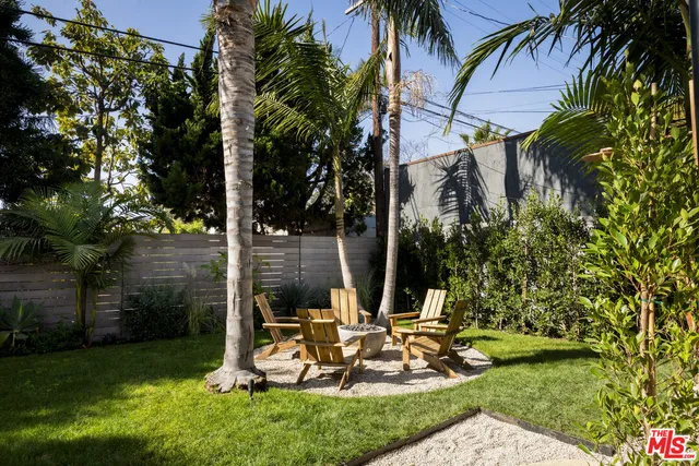 a view of a backyard with a sitting area
