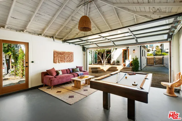 a room with furniture and a large window