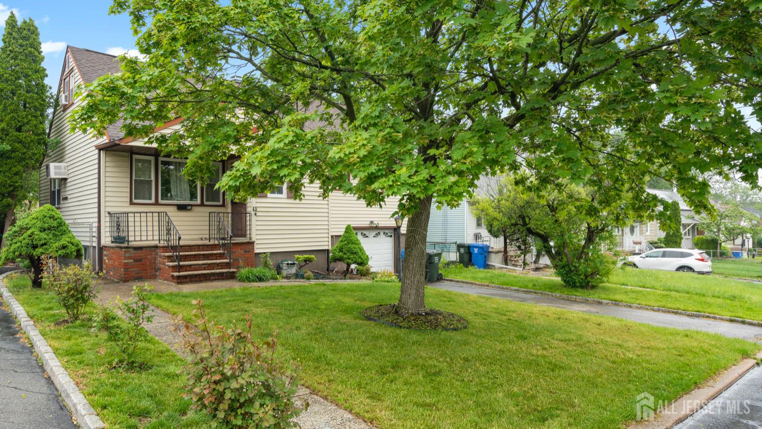 149 Ethel Street Menlo Park Terrace, NJ 08840 - Photo 1 of 26 a front view of a house with garden