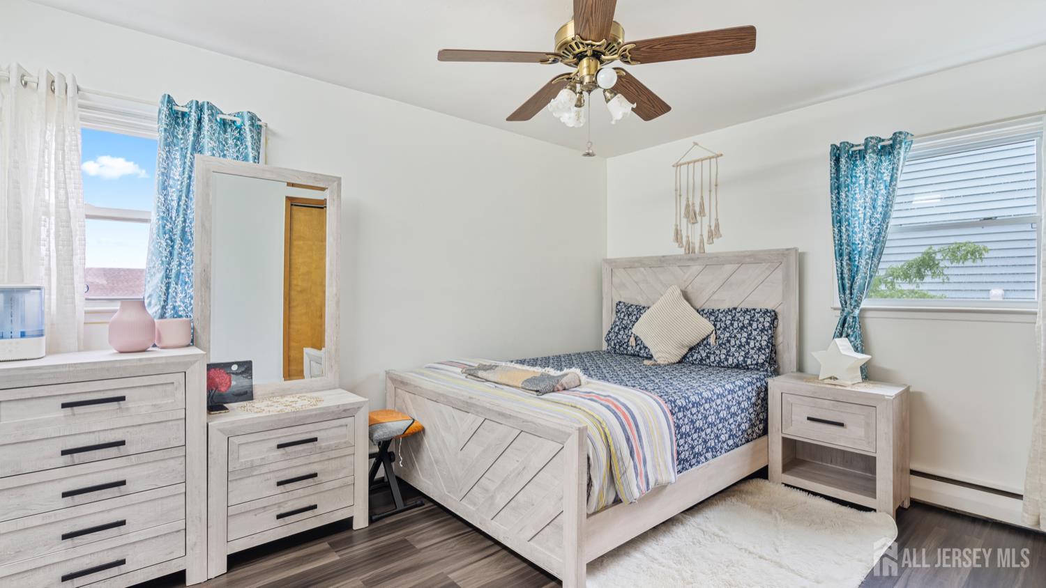 149 Ethel Street Menlo Park Terrace, NJ 08840 - Photo 14 of 26 a bedroom with a bed and a chandelier