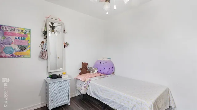 a bedroom with a bed and chandelier