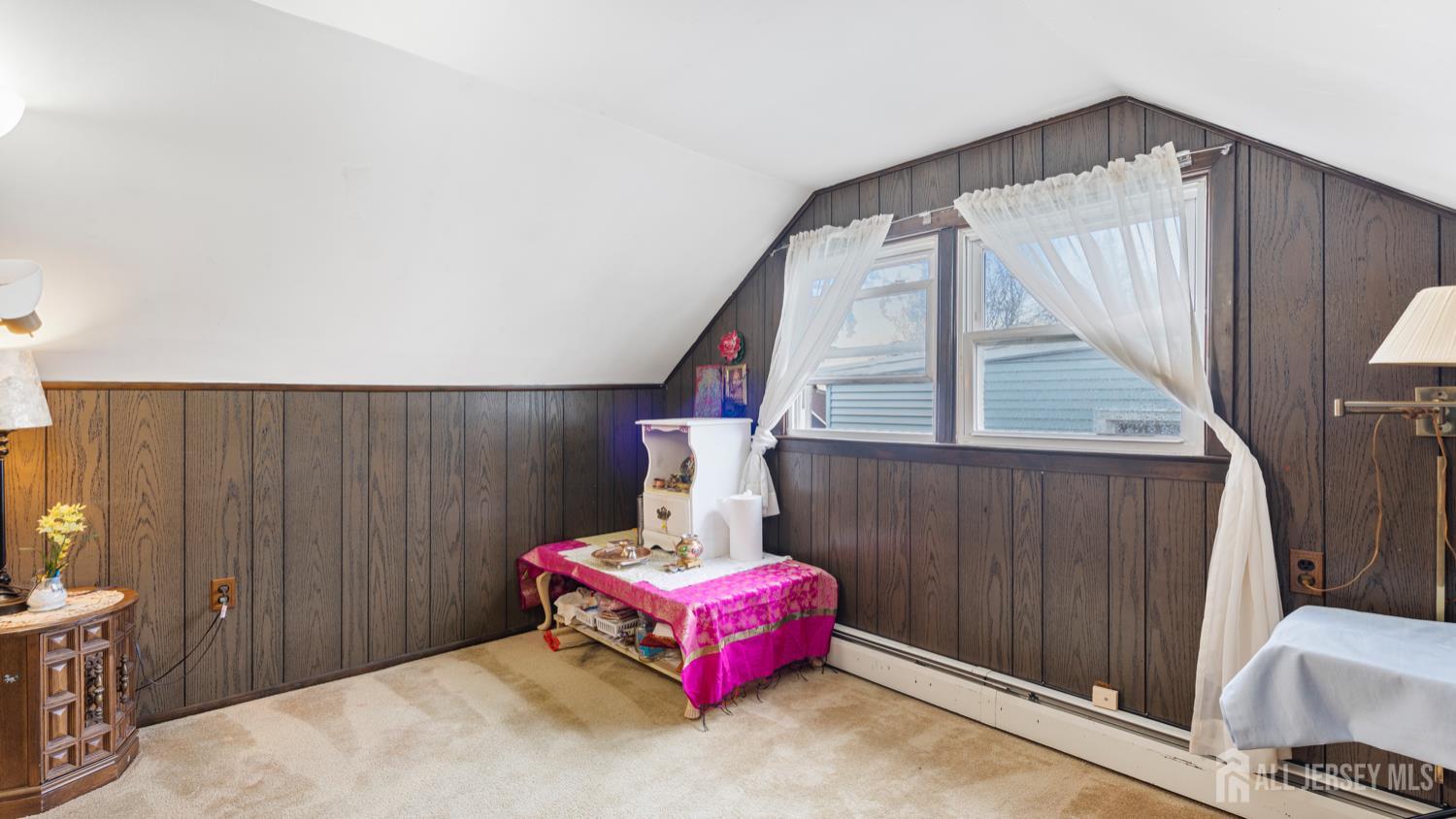 149 Ethel Street Menlo Park Terrace, NJ 08840 - Photo 18 of 26 a bed room with a bed and a couch