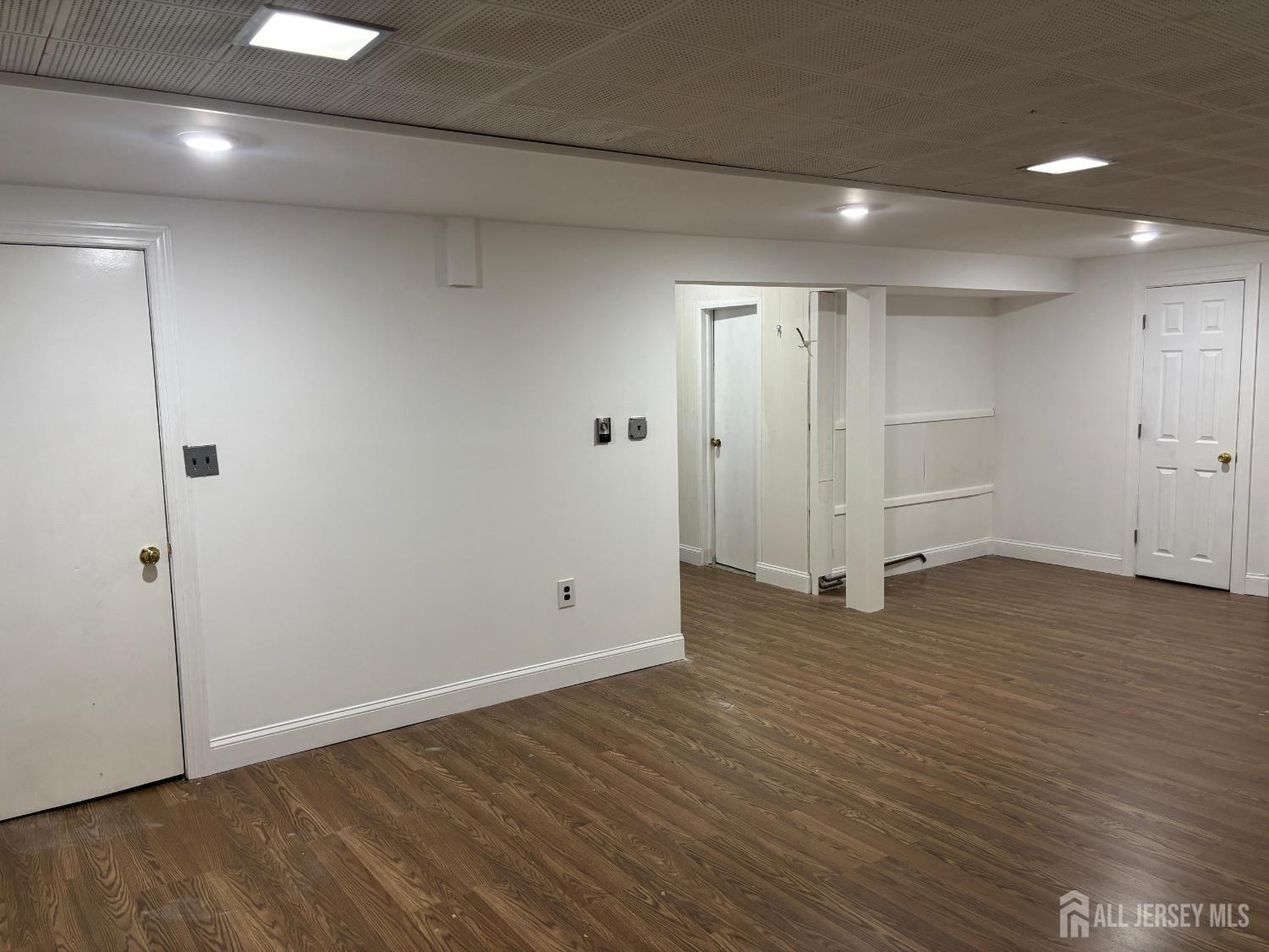 149 Ethel Street Menlo Park Terrace, NJ 08840 - Photo 24 of 26 a view of an empty room with wooden floor