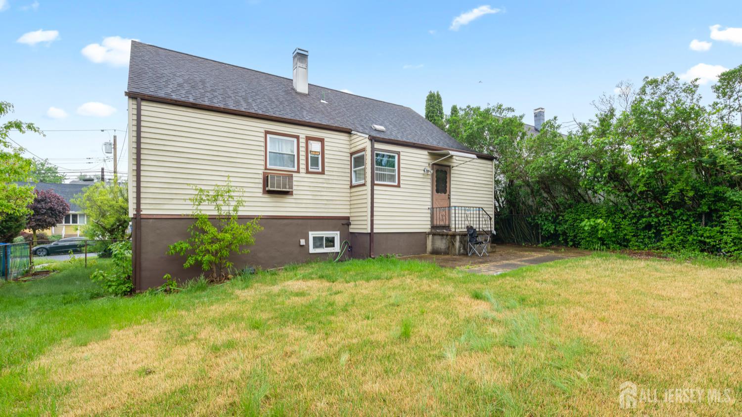 149 Ethel Street Menlo Park Terrace, NJ 08840 - Photo 3 of 26 a view of a house with backyard and sitting area