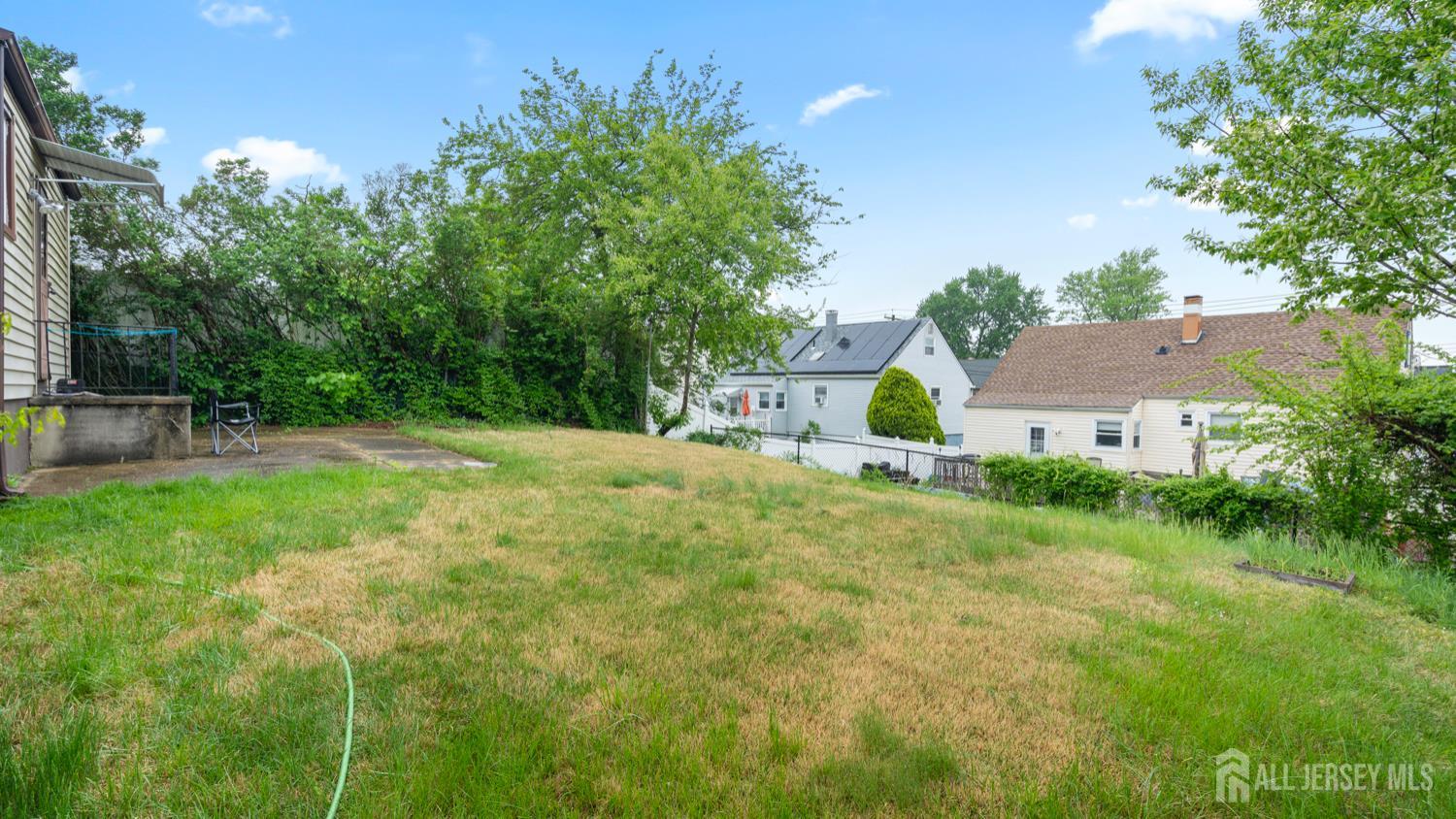 149 Ethel Street Menlo Park Terrace, NJ 08840 - Photo 4 of 26 a view of house with a yard