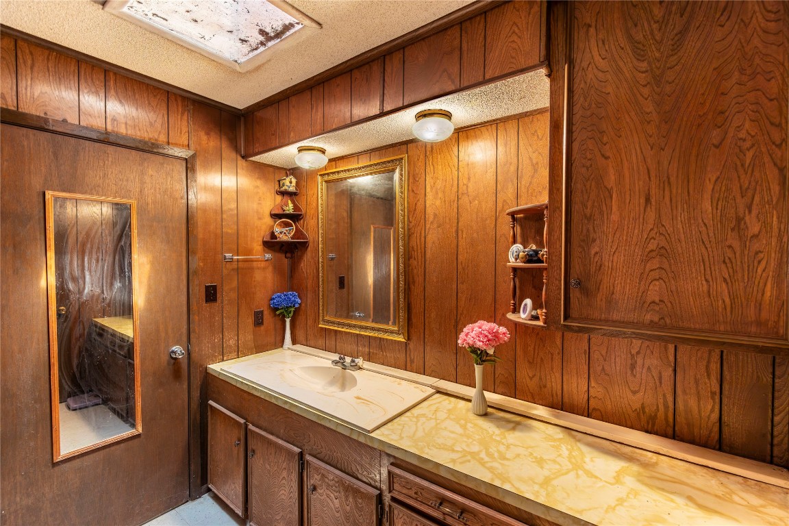 125 Forrest Lane Brenham, TX 77833 - Photo 12 of 13 a bathroom with a mirror and a shower