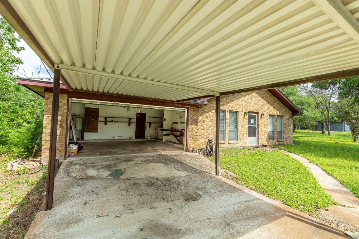 125 Forrest Lane Brenham, TX 77833 - Photo 13 of 13 a view of a house with backyard and garden