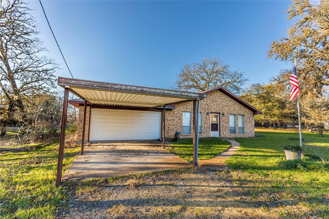 125 Forrest Lane Brenham, TX 77833 - Photo 7 of 13 a view of a house with a yard