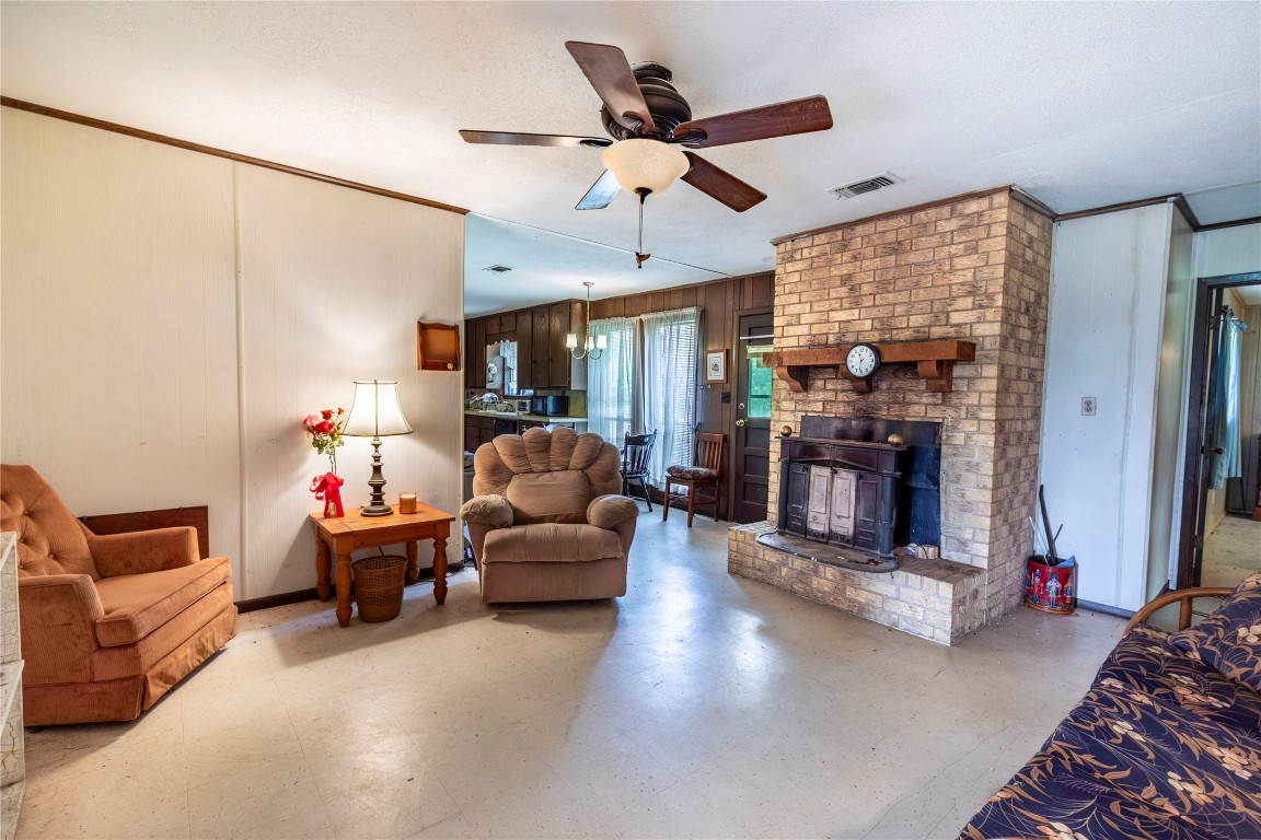 125 Forrest Lane Brenham, TX 77833 - Photo 10 of 13 a living room with furniture and a fireplace