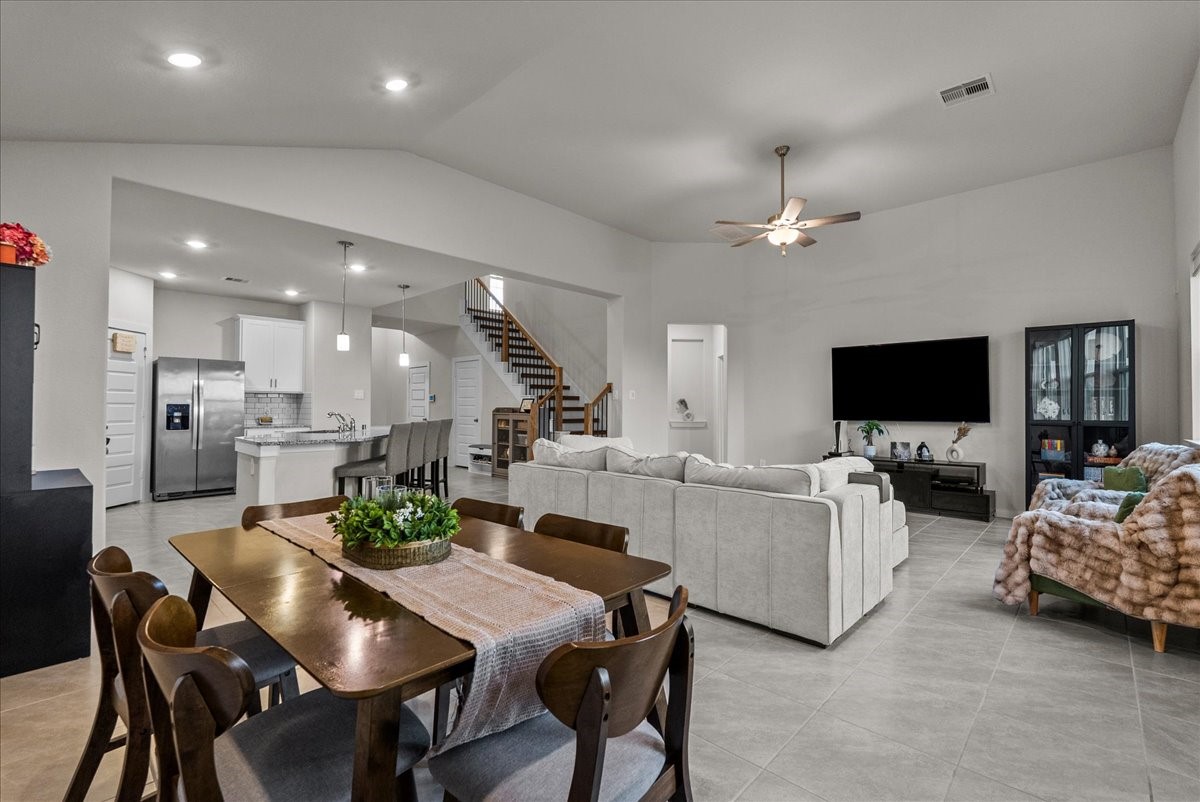 10831 Bodie Hls Drive Rosharon, TX 77583 - Photo 13 of 46 High ceilings enhance the dining space, which can also be positioned to enjoy views of the living area