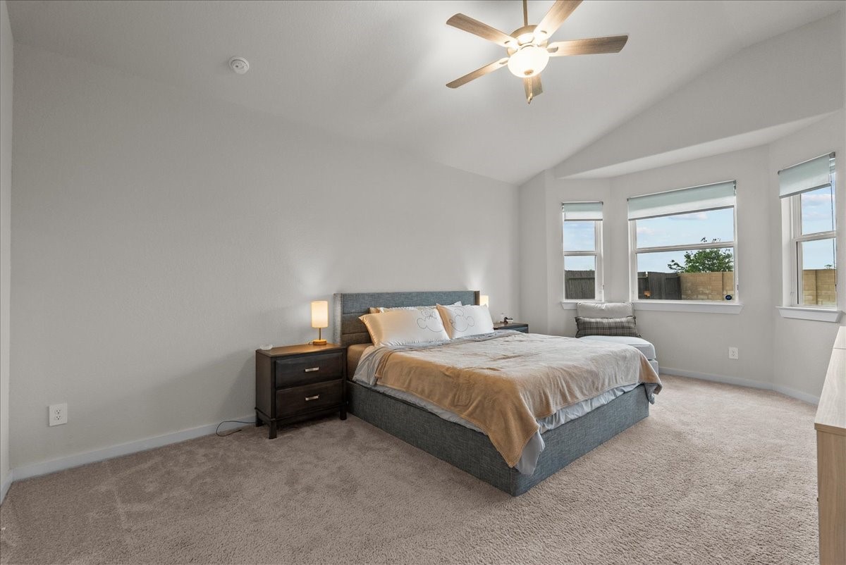 10831 Bodie Hls Drive Rosharon, TX 77583 - Photo 17 of 46 The spacious primary suite is located on the first floor in a private rear corner of the home.