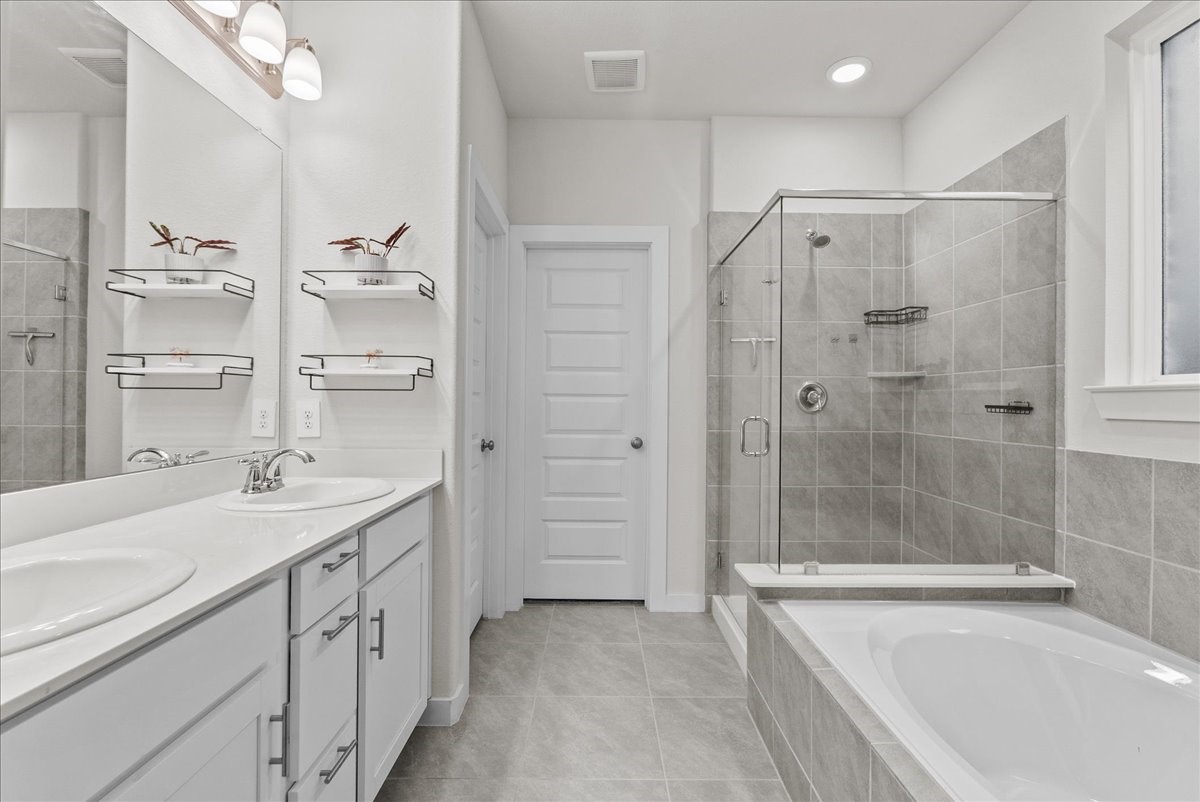 10831 Bodie Hls Drive Rosharon, TX 77583 - Photo 20 of 46 The primary bathroom includes dual sinks with abundant cabinet storage.
