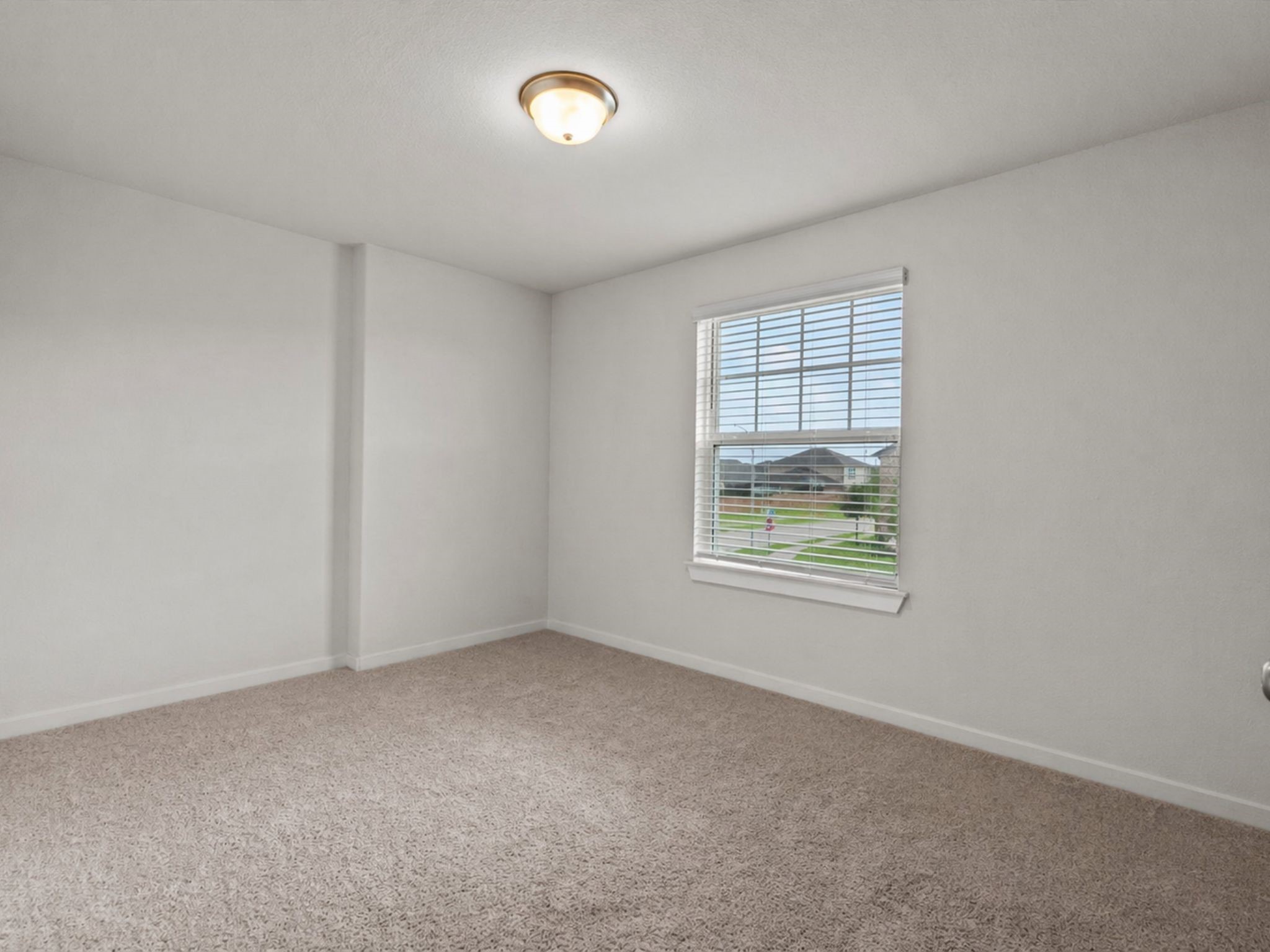 10831 Bodie Hls Drive Rosharon, TX 77583 - Photo 27 of 46 The first secondary bedroom is adaptable to any style and offers a view of the front street.