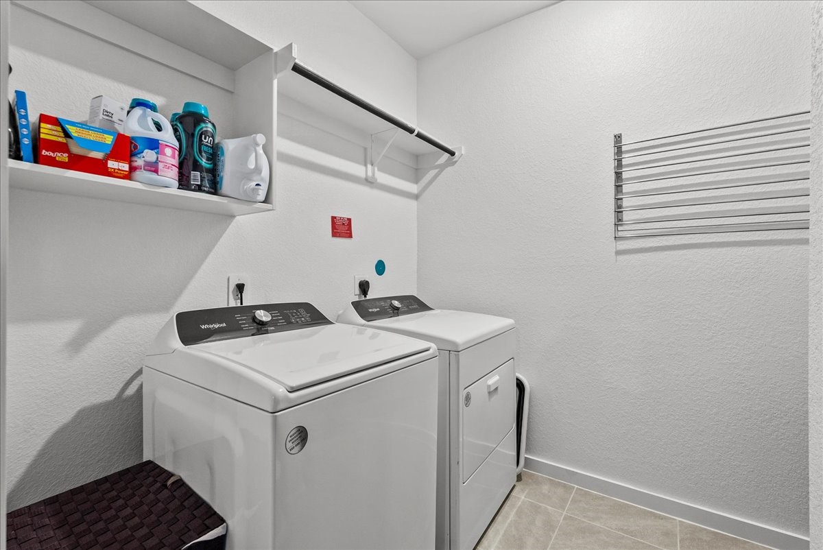 10831 Bodie Hls Drive Rosharon, TX 77583 - Photo 34 of 46 An in-home utility room provides washer and dryer connections along with extra storage space.