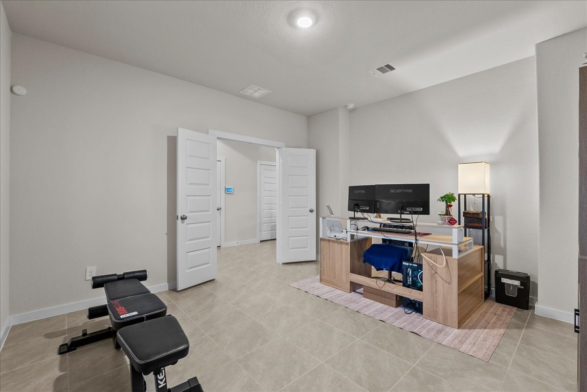 10831 Bodie Hls Drive Rosharon, TX 77583 - Photo 4 of 46 The office features large, double doors for added privacy and functionality.