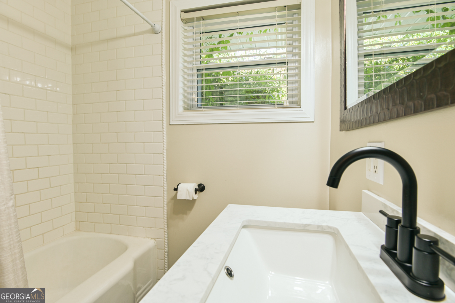545 Forest Hill Road Macon, GA 31210 - Photo 47 of 63 a bath tub sitting in a bathroom next to a window