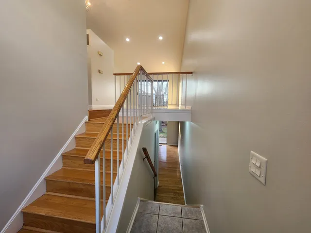a kitchen with stainless steel appliances granite countertop a sink and a stove
