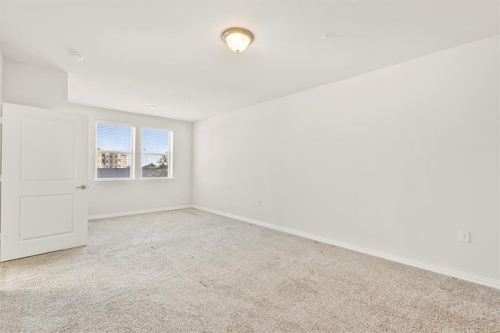 651 Watters Road, Unit 7202 Allen, TX 75013 - Photo 14 of 33 an empty room with windows and closet