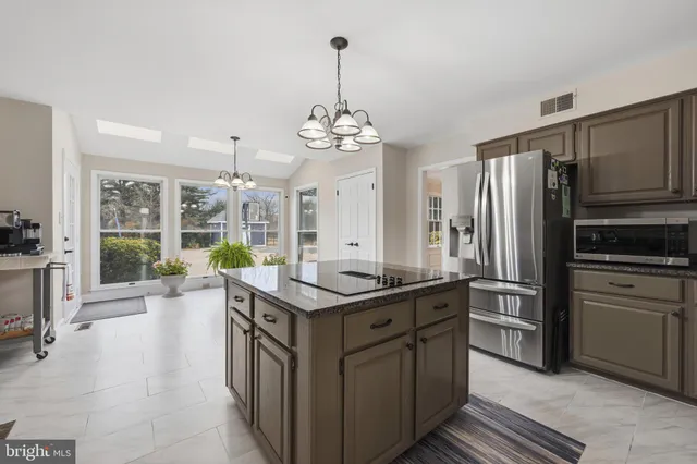 a spacious bedroom with a bed and a fireplace