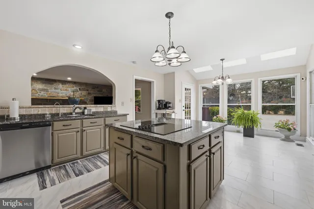 a spacious bedroom with a bed and a fireplace