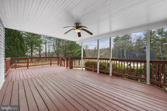 a black and white photo of a bench