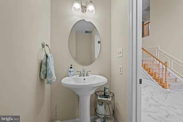 a kitchen with kitchen island granite countertop stainless steel appliances a stove oven and a refrigerator