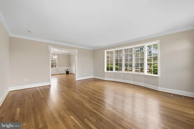 a kitchen with kitchen island granite countertop a sink stove and refrigerator