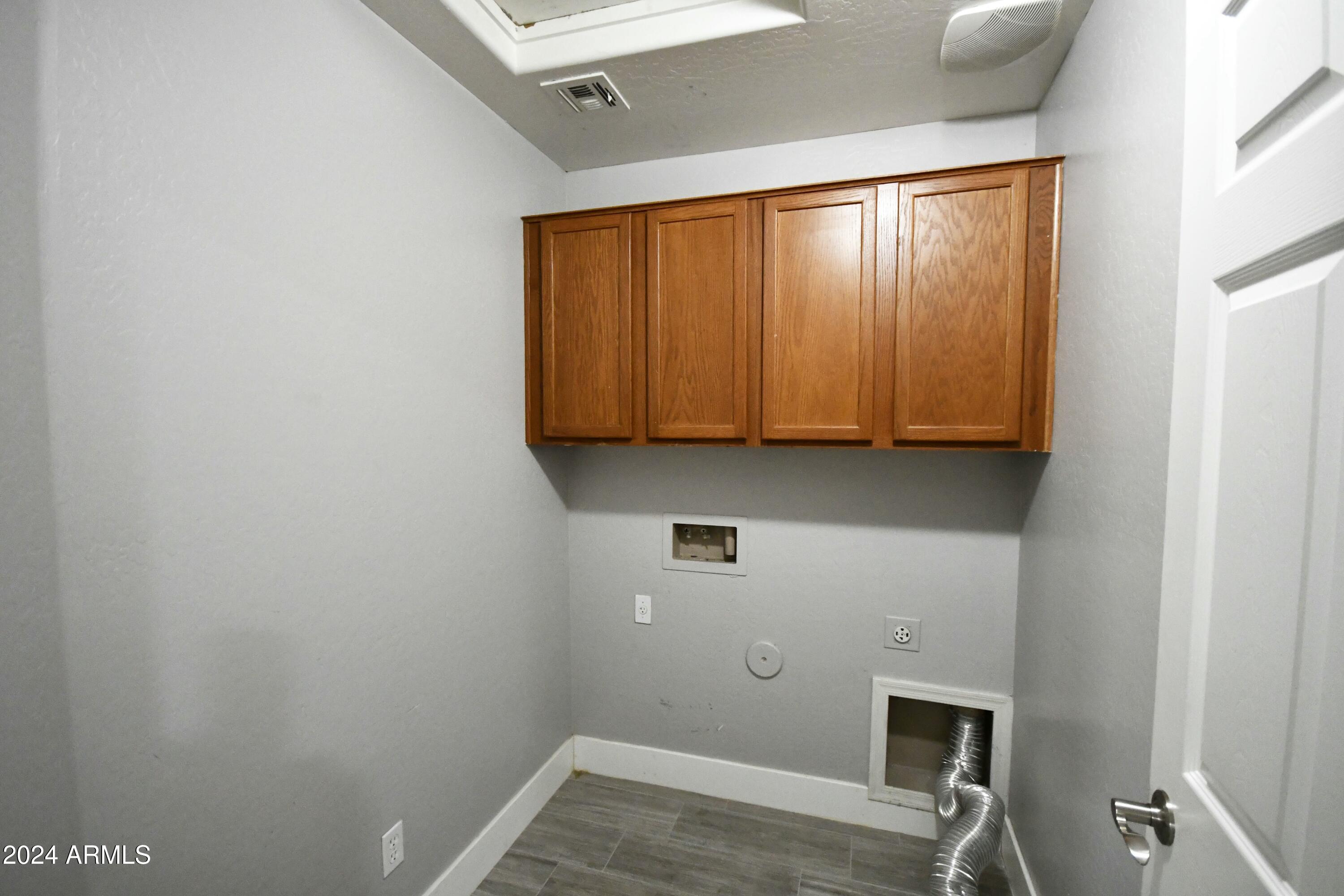 2414 West Gaby Road Phoenix, AZ 85041 - Photo 17 of 17 a room with a sink and a window