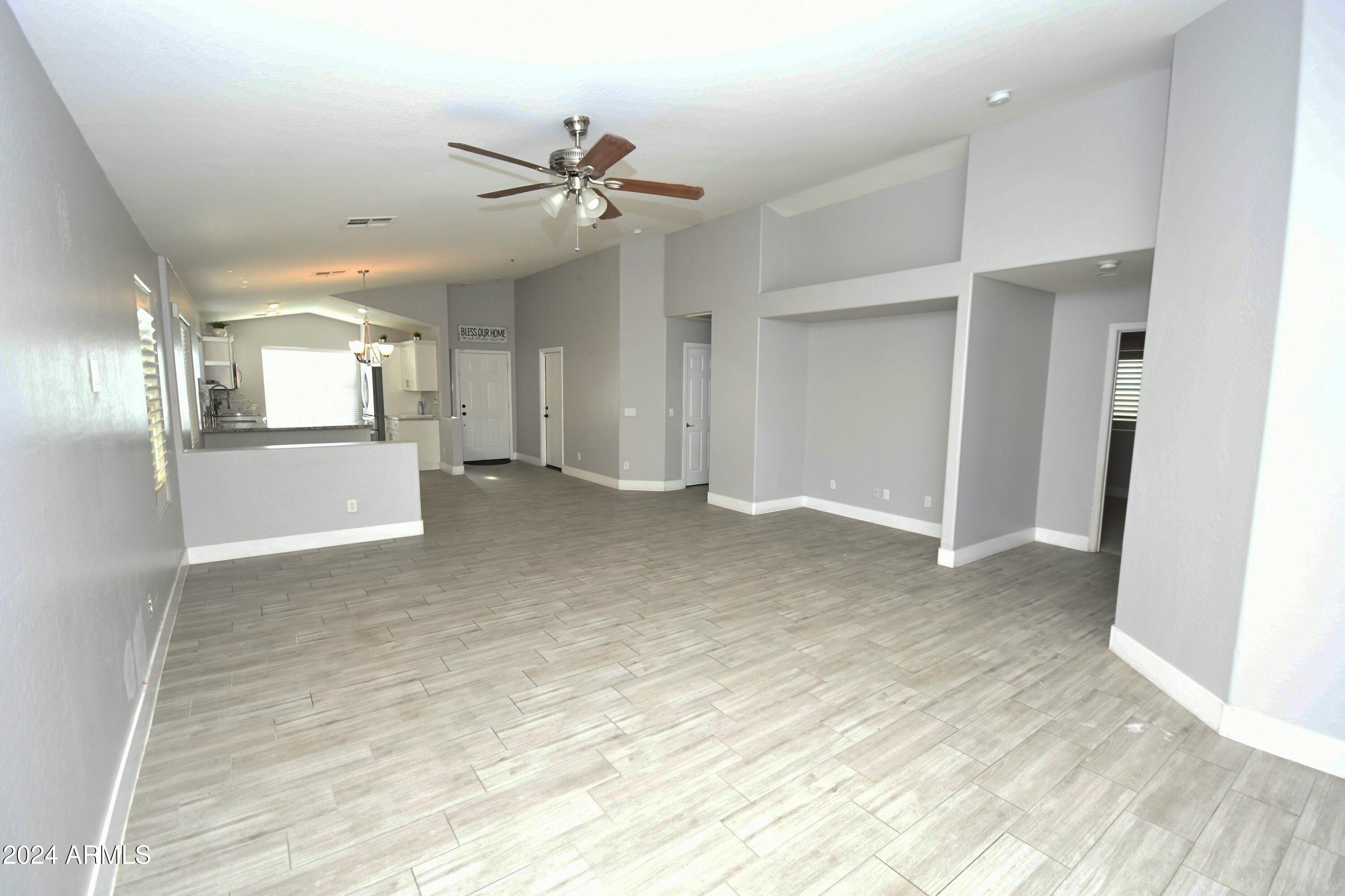 2414 West Gaby Road Phoenix, AZ 85041 - Photo 6 of 17 a view of a livingroom with a staircase