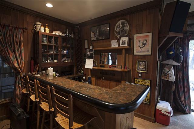 6040 South Mt Juliet Road Hermitage, TN 37076 - Photo 17 of 17 a room with lots of frames on wall and a chandelier