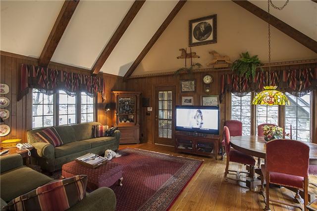 6040 South Mt Juliet Road Hermitage, TN 37076 - Photo 4 of 17 a living room with furniture a rug and a chandelier