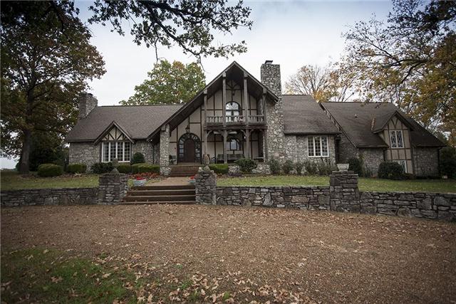 6040 South Mt Juliet Road Hermitage, TN 37076 - Photo 8 of 17 a front view of a house with a yard