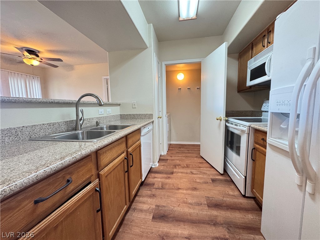 7255 West Sunset Road, Unit 2111 Las Vegas, NV 89113 - Photo 11 of 33 A well-appointed kitchen features ample counter space and a convenient pass-through to the living area.