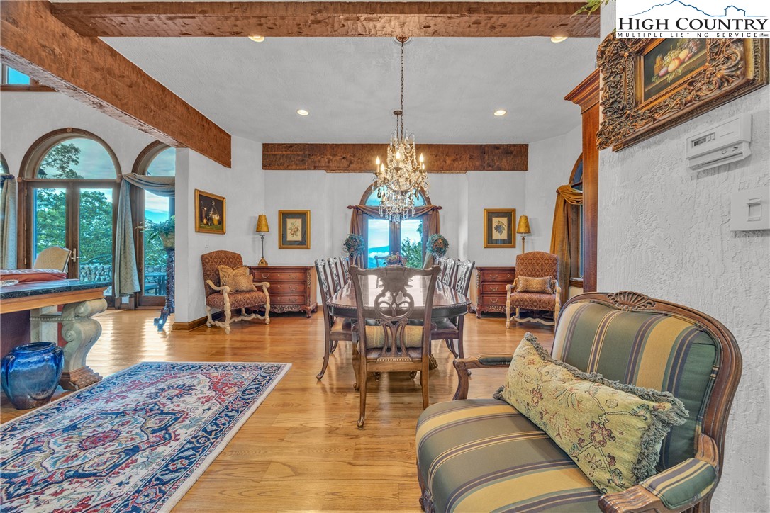 530 Howards Knob Road Boone, NC 28607 - Photo 11 of 49 a living room with furniture chandelier and a rug
