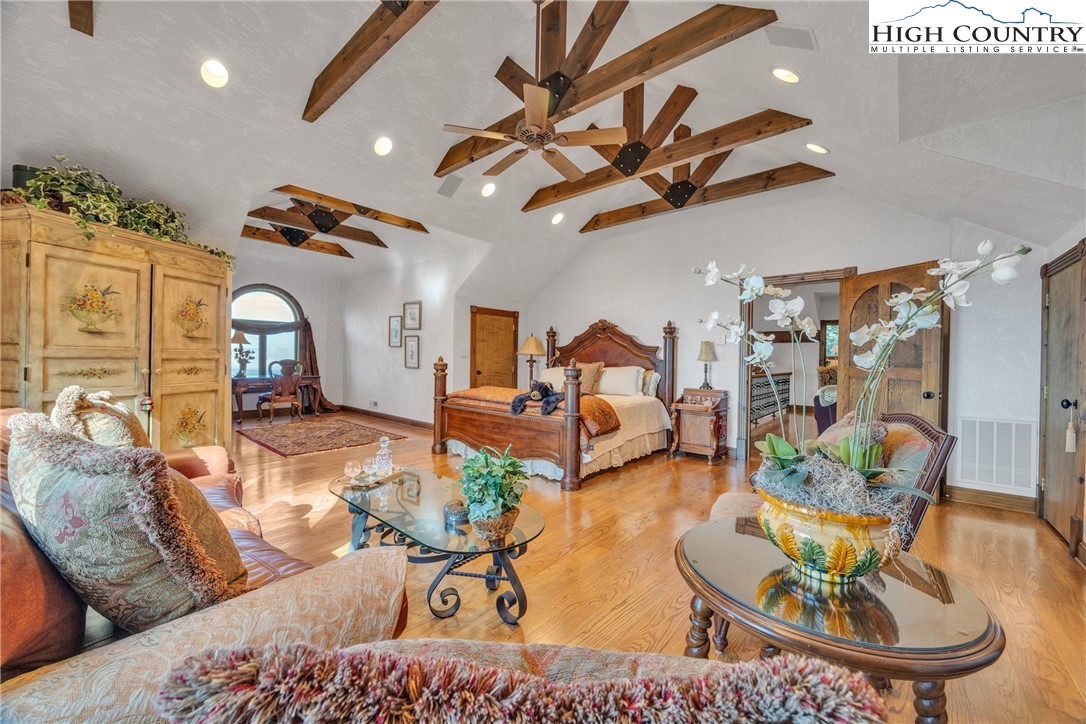530 Howards Knob Road Boone, NC 28607 - Photo 22 of 49 a living room with furniture and a chandelier